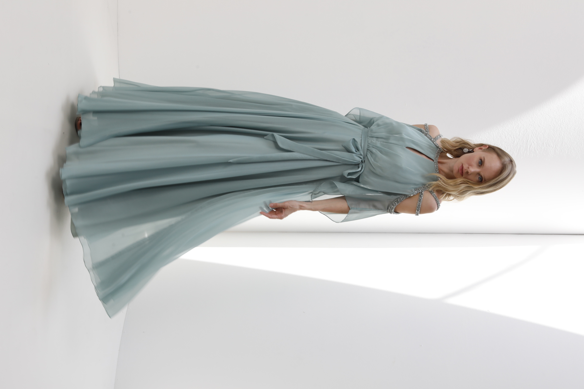 Sage chiffon gown with beaded cold-shoulder detail and tie waist