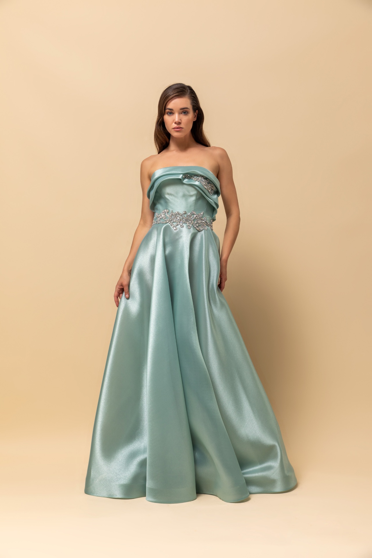 Sage green strapless satin ball gown with crystal appliqué belt