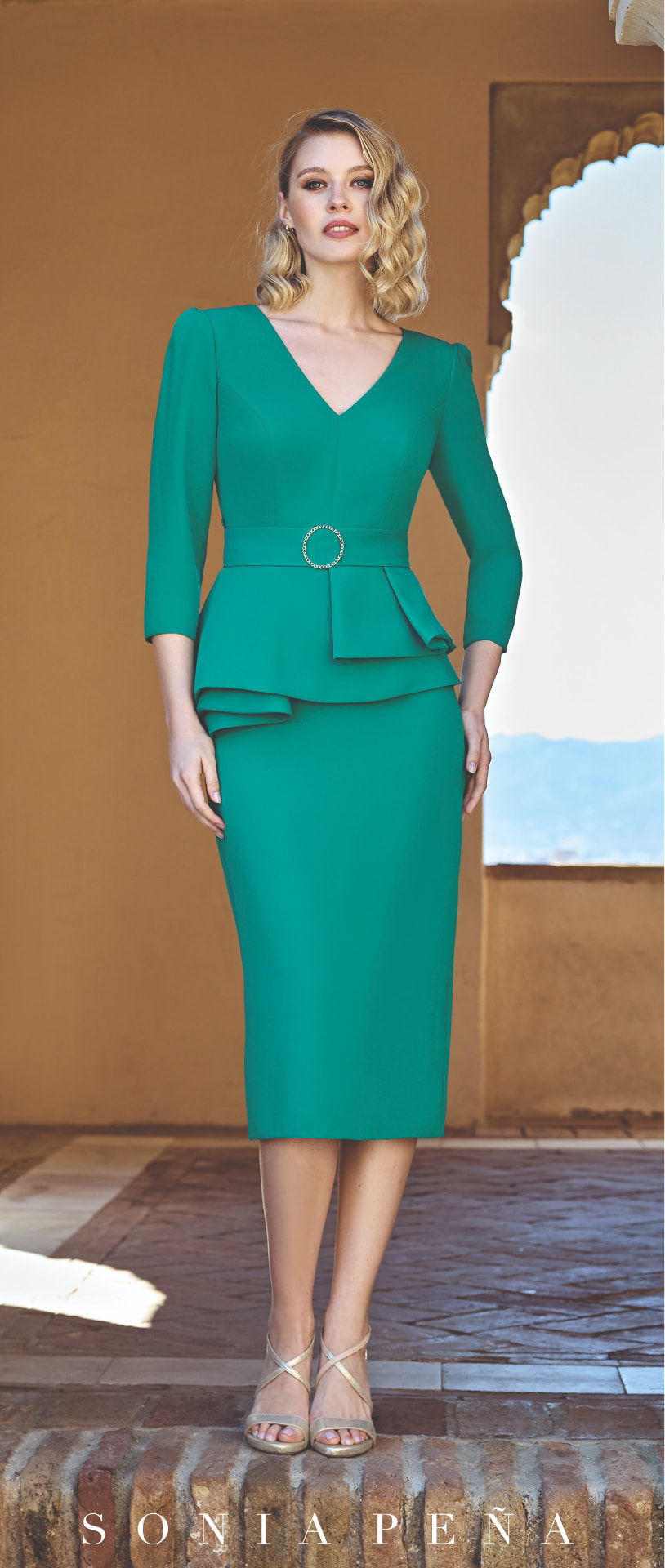 Emerald green peplum midi dress with crystal circle buckle belt
