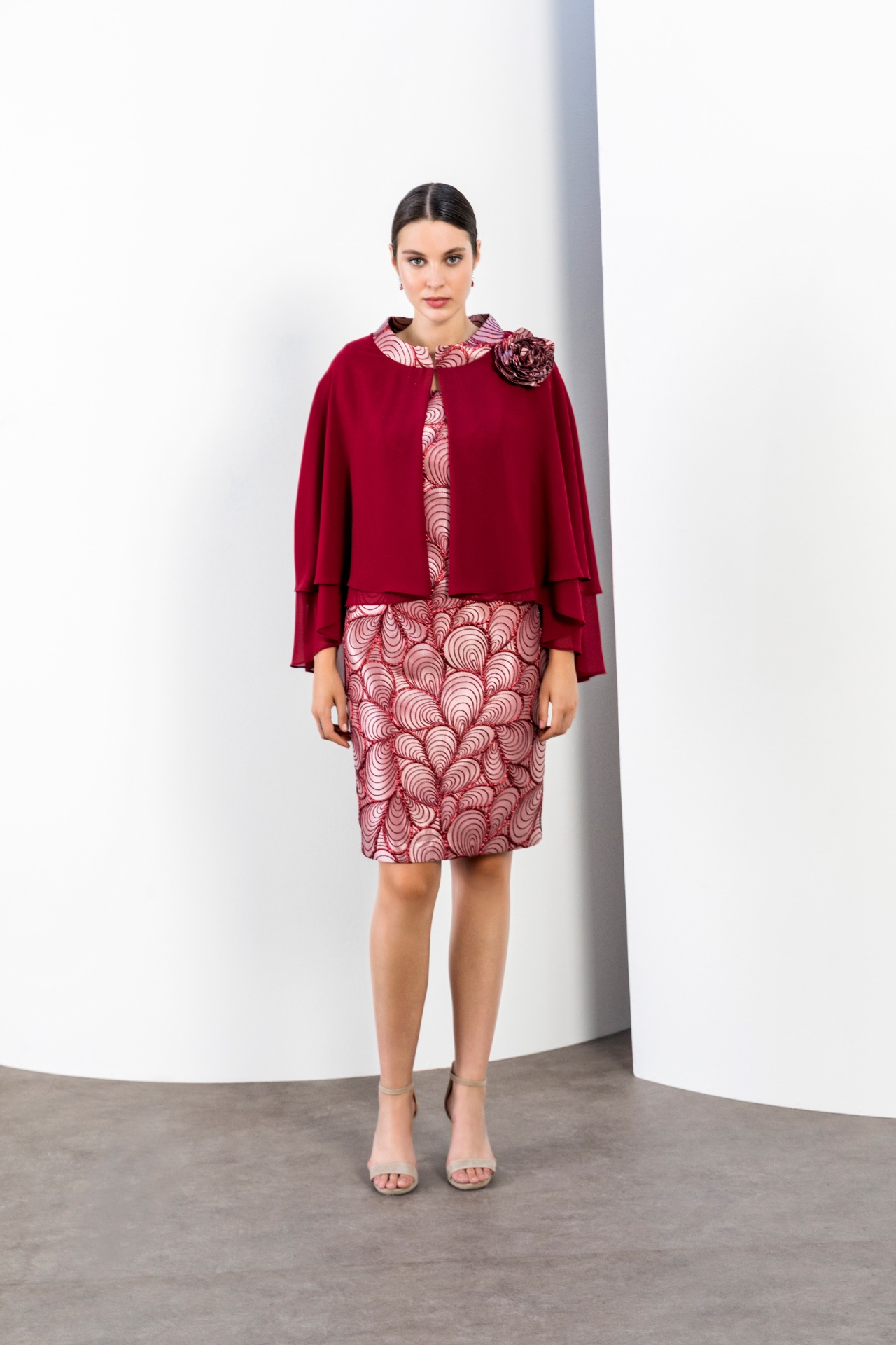 Burgundy chiffon tiered cape over red art deco print pencil dress