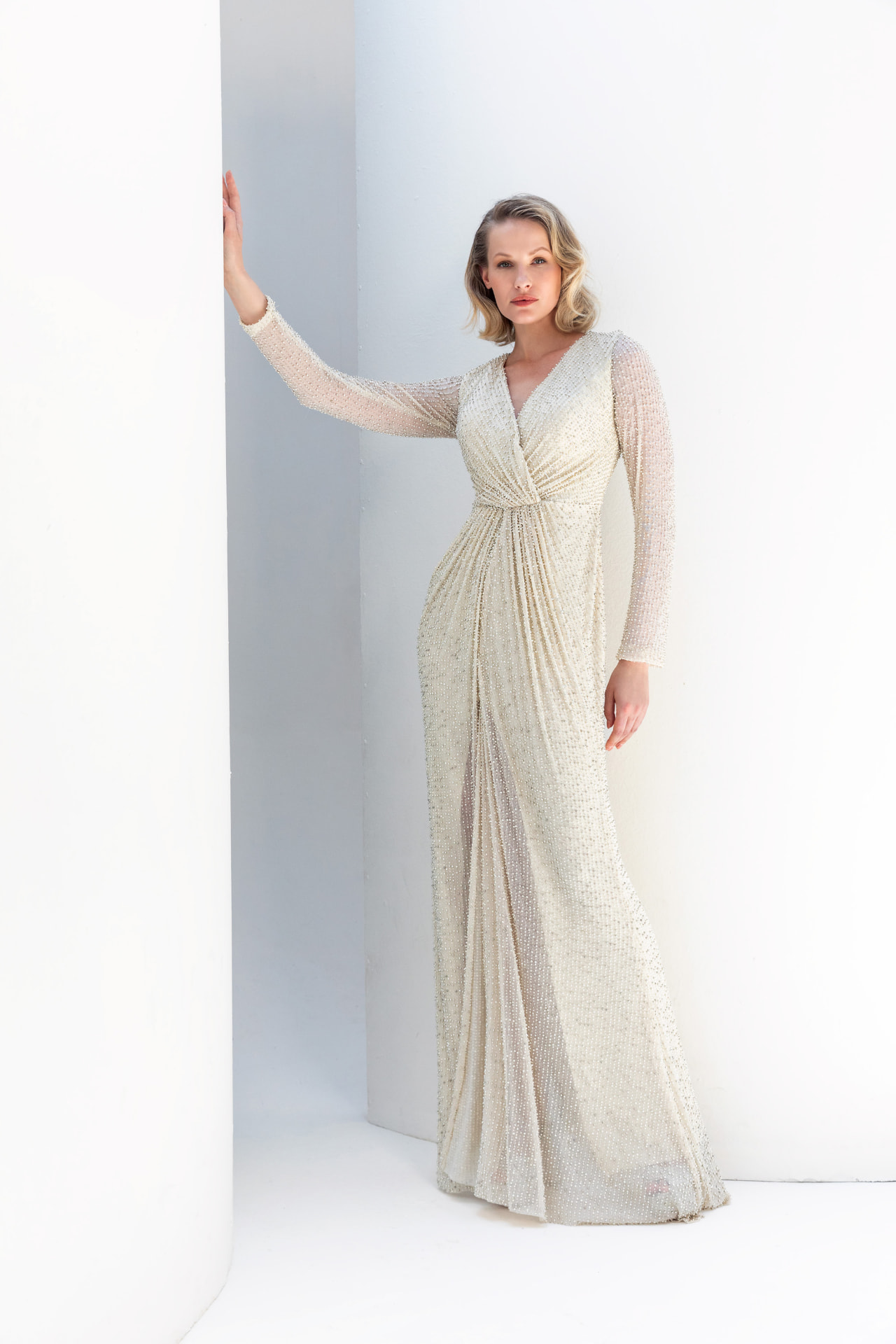 Ivory pearl-beaded long-sleeve gown with wrap V-neck and draped skirt